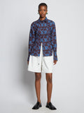 Front image of model wearing Sunflower Poplin Shirt in sky blue/wine