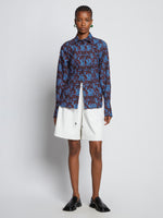 Front image of model wearing Sunflower Poplin Shirt in sky blue/wine