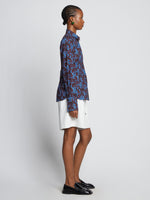 Side image of model wearing Sunflower Poplin Shirt in sky blue/wine