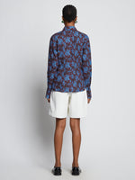 Back image of model wearing Sunflower Poplin Shirt in sky blue/wine