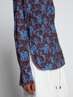 Detail image of model wearing Sunflower Poplin Shirt in sky blue/wine