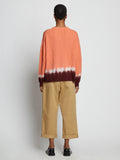 Back full length image of model wearing Rib Knit Dip Dye Sweater in SALMON MULTI