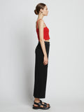 Side full length image of model wearing Cotton Cashmere Tank Top in POPPY