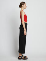Side full length image of model wearing Cotton Cashmere Tank Top in POPPY