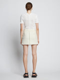 Back full length image of model wearing Tweed Mini Skirt in OFF WHITE