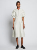 Front full length image of model wearing Faux Leather Puff Sleeve Dress in OFF WHITE