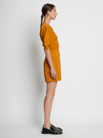 Side full length image of model wearing Technical Stretch Linen Dress in CARAMEL
