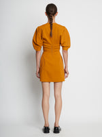 Back full length image of model wearing Technical Stretch Linen Dress in CARAMEL