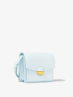 Front 3/4 image of Embossed Croc Dia Day Bag in pale blue