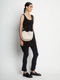 Image of model carrying Small Ruched Crossbody Tote in CLAY on shoulder