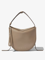 Front image of Baxter Leather Bag in CLAY with straps hanging