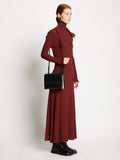 Image of model carrying Accordion Flap Bag in BLACK on shoulder
