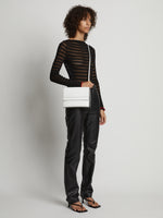 Image of model carrying Accordion Flap Bag in OPTIC WHITE on shoulder