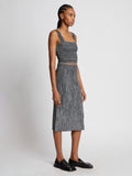 Side full length image of model wearing Melange Knit Midi Skirt in BLACK/WHITE