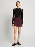 Front full length image of model wearing Faux Leather Smocked Mini Skirt in PLUM