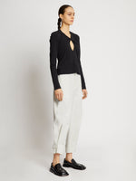 Side full length image of model wearing Cotton Twill Tapered Pants in OFF WHITE