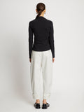 Back full length image of model wearing Cotton Twill Tapered Pants in OFF WHITE