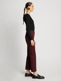 Side full length image of model wearing Cotton Twill Cropped Pants in PLUM