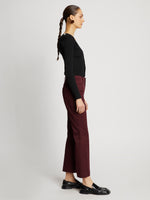 Side full length image of model wearing Cotton Twill Cropped Pants in PLUM