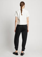 Back full length image of model wearing Cotton Twill Tapered Pants in BLACK
