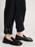 Detail image of model wearing Cotton Twill Tapered Pants in BLACK