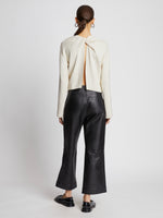 Back full length image of model wearing Twist Long Sleeve Sweater in CREAM