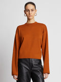 Front cropped image of model wearing Twist Long Sleeve Sweater in HONEY