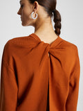 Detail image of model wearing Twist Long Sleeve Sweater in HONEY