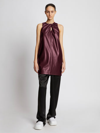 Front full length image of model wearing Faux Leather Sleeveless Dress in PLUM