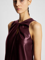 Detail image of model wearing Faux Leather Sleeveless Dress in PLUM