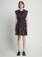 Front full length image of model wearing Faux Leather Drawstring Dress in BLACK