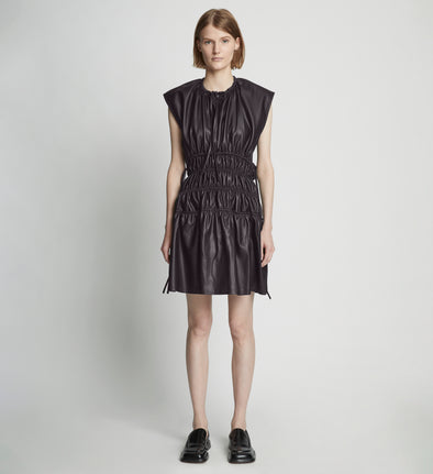 Front full length image of model wearing Faux Leather Drawstring Dress in BLACK