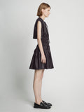 Side full length image of model wearing Faux Leather Drawstring Dress in BLACK