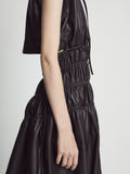 Detail image of model wearing Faux Leather Drawstring Dress in BLACK