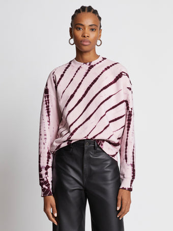 Front cropped image of model wearing Tie Dye Sweatshirt in LIGHT PINK/PLUM