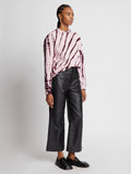 Side full length image of model wearing Tie Dye Sweatshirt in LIGHT PINK/PLUM