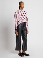 Side full length image of model wearing Tie Dye Sweatshirt in LIGHT PINK/PLUM
