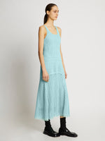 Side full length image of model wearing Open Knit Dress in PALE BLUE