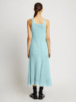 Back full length image of model wearing Open Knit Dress in PALE BLUE