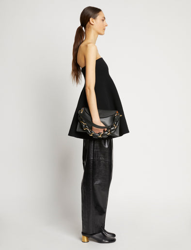 Image of model carrying Braid Bag in BLACK