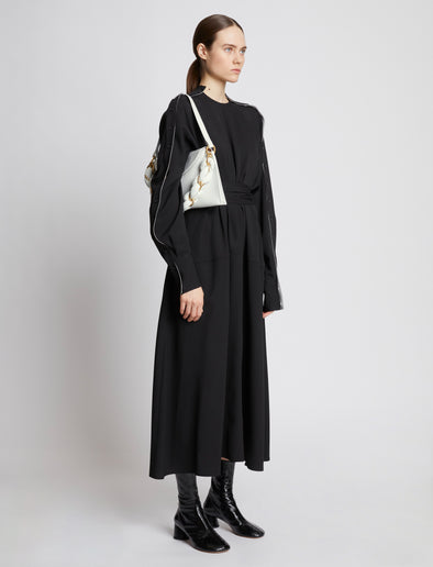 Image of model carrying Braid Bag in OPTIC WHITE on shoulder