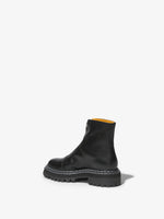 Back 3/4 image of Lug Sole Zip Boots in Black
