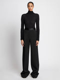 Front full length image of model wearing Wool Twill Satin Trim Pants in BLACK
