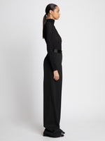 Side full length image of model wearing Wool Twill Satin Trim Pants in BLACK