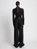 Back full length image of model wearing Wool Twill Satin Trim Pants in BLACK