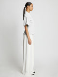 Side full length image of model wearing Eco Cotton Waisted T-Shirt in WHITE