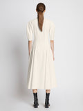 Back full length image of model wearing Cotton Viscose Zip Front Dress in ECRU