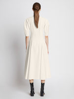 Back full length image of model wearing Cotton Viscose Zip Front Dress in ECRU
