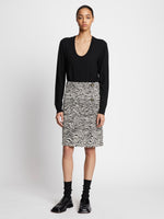 Front full length image of model wearing Eco Superfine Merino Scoop Neck Sweater in BLACK