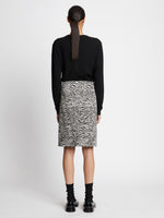 Back full length image of model wearing Eco Superfine Merino Scoop Neck Sweater in BLACK